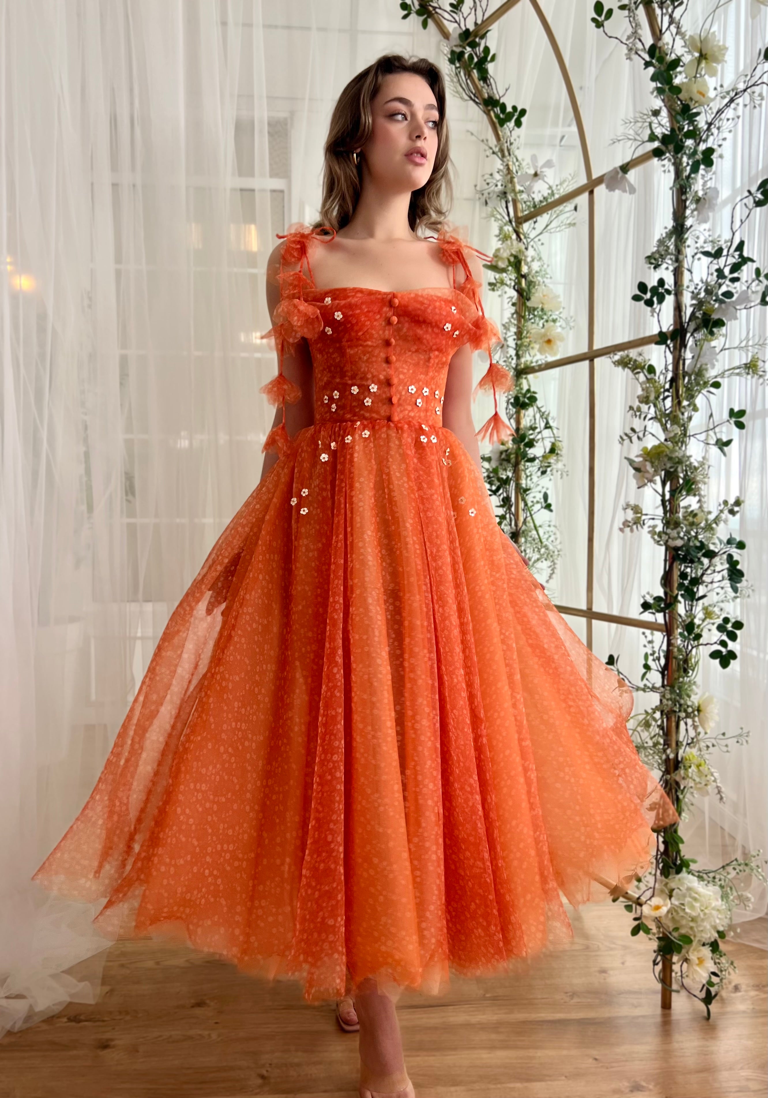 Orange midi dress with straps and embroidery and daisies