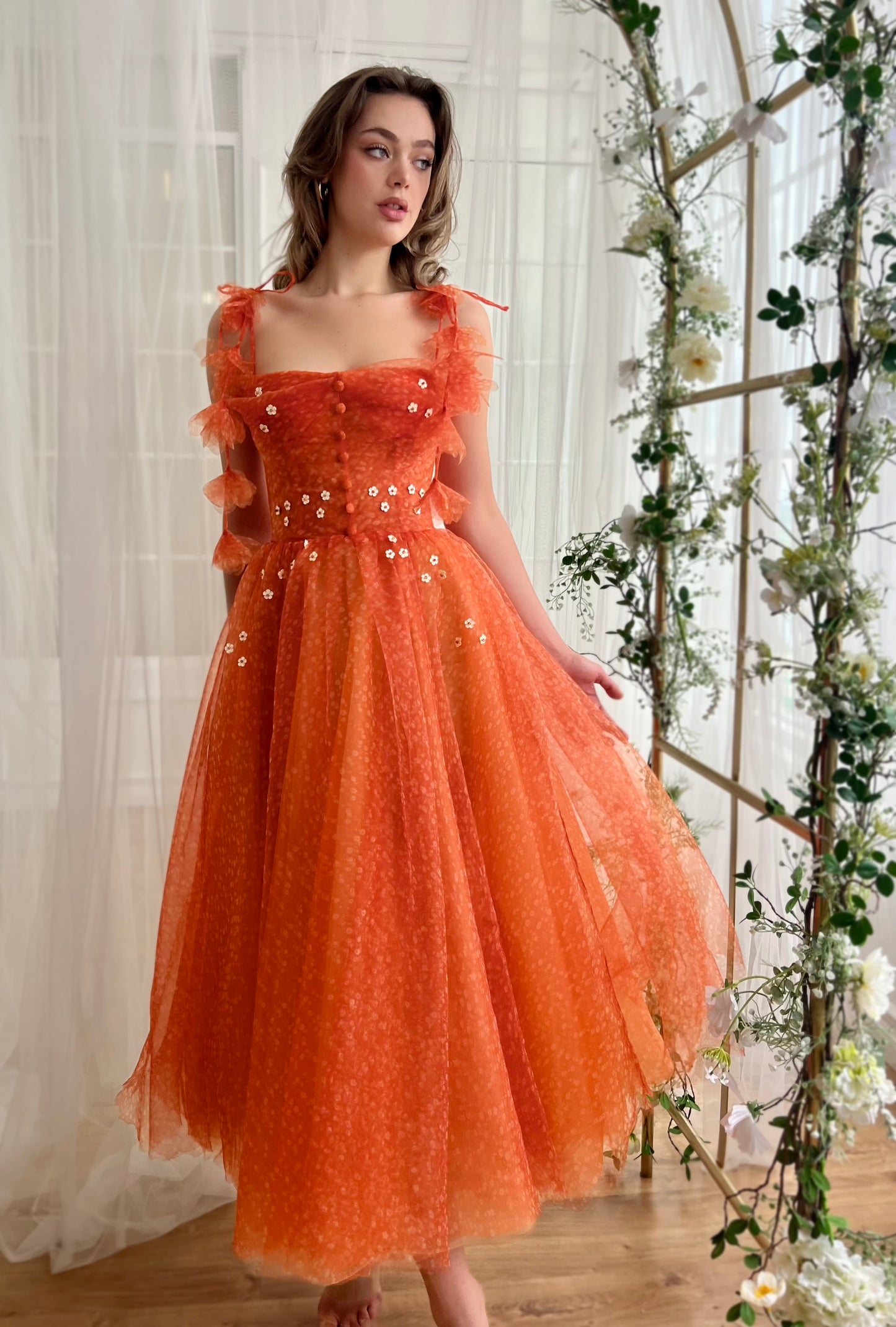 Orange midi dress with straps and embroidery and daisies