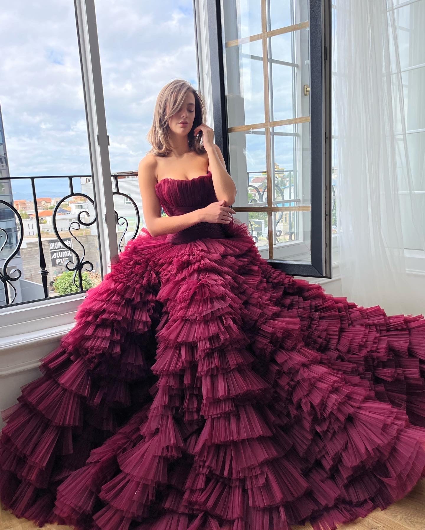 Red A-Line gown with ruffles and no sleeves