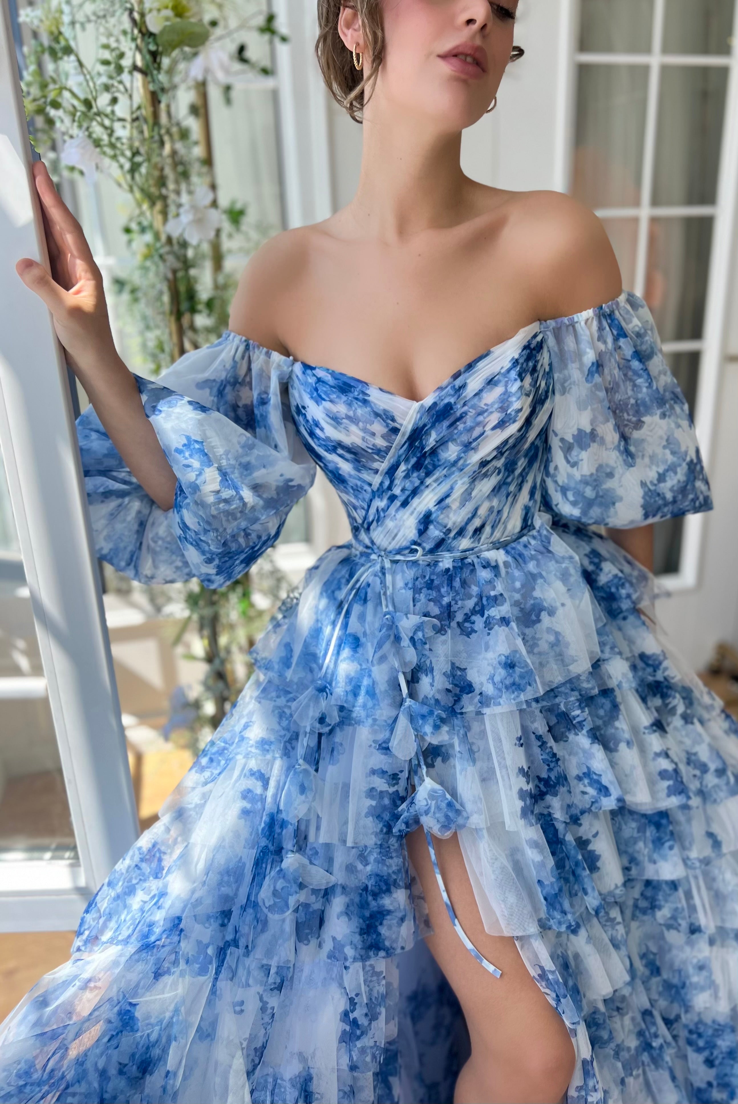 Blue A-Line dress with floral print, spaghetti straps and off the shoulder sleeves