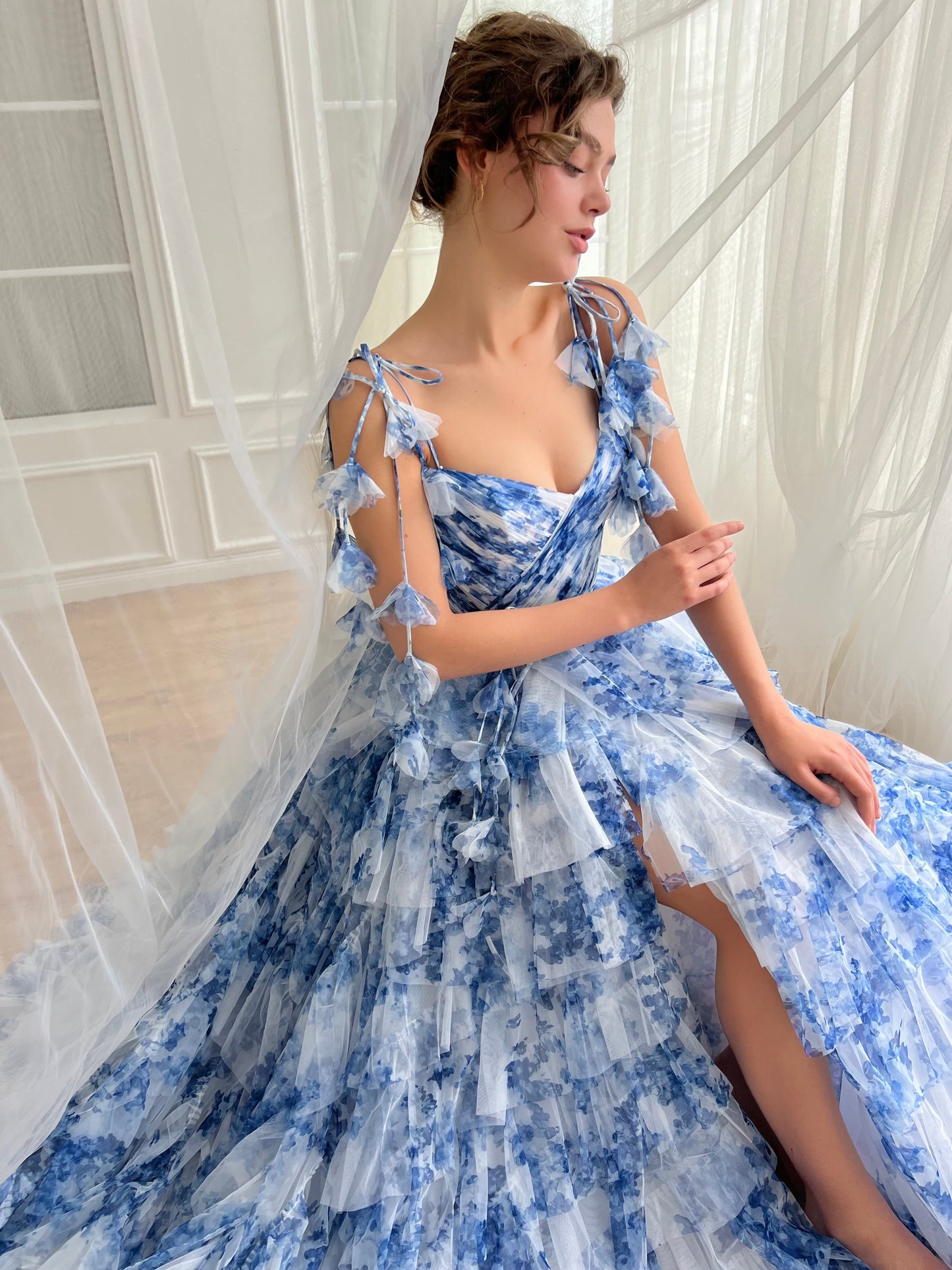 Blue A-Line dress with floral print, spaghetti straps and off the shoulder sleeves