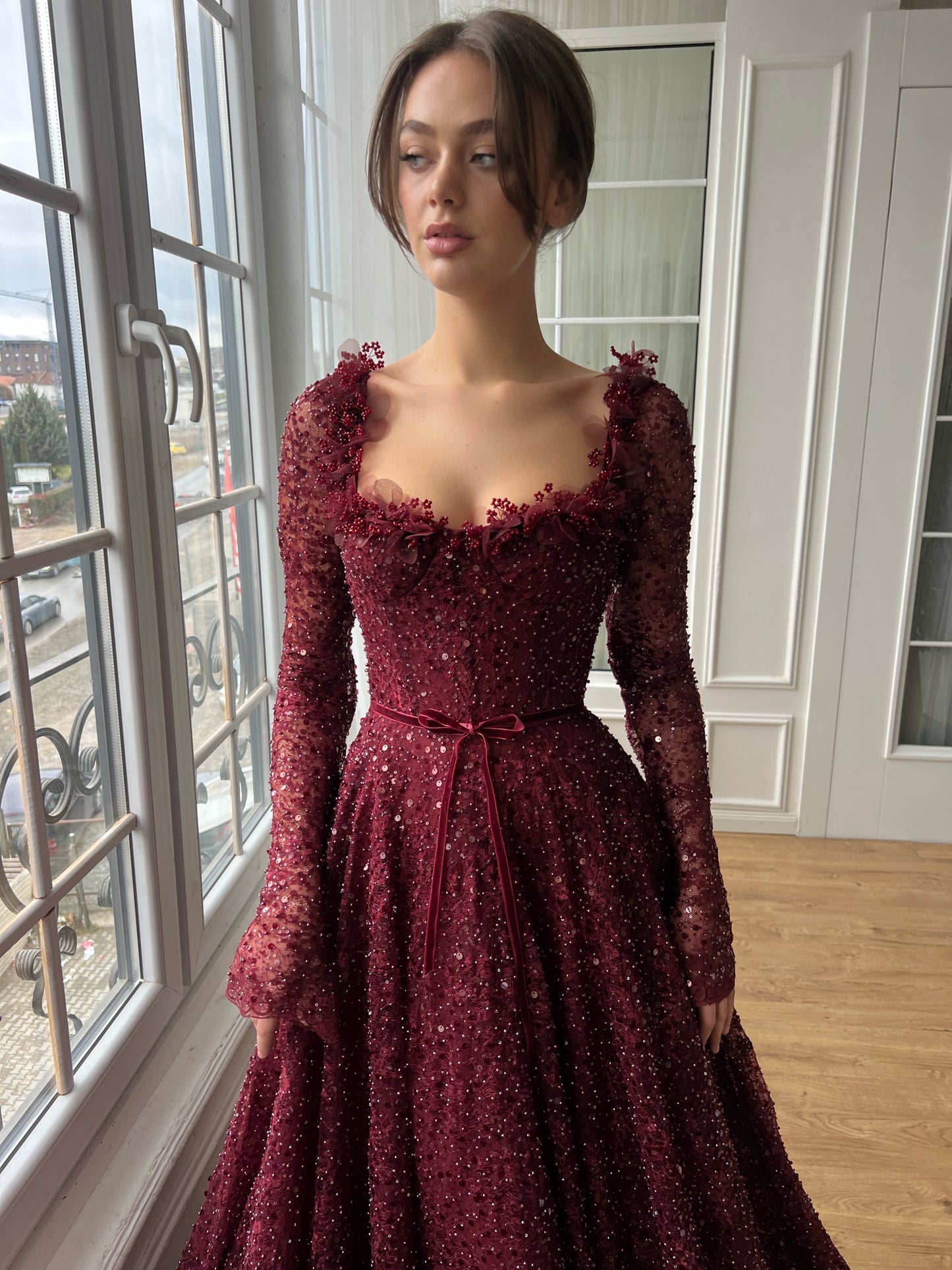 Red A-Line gown with long sleeves and embroidery