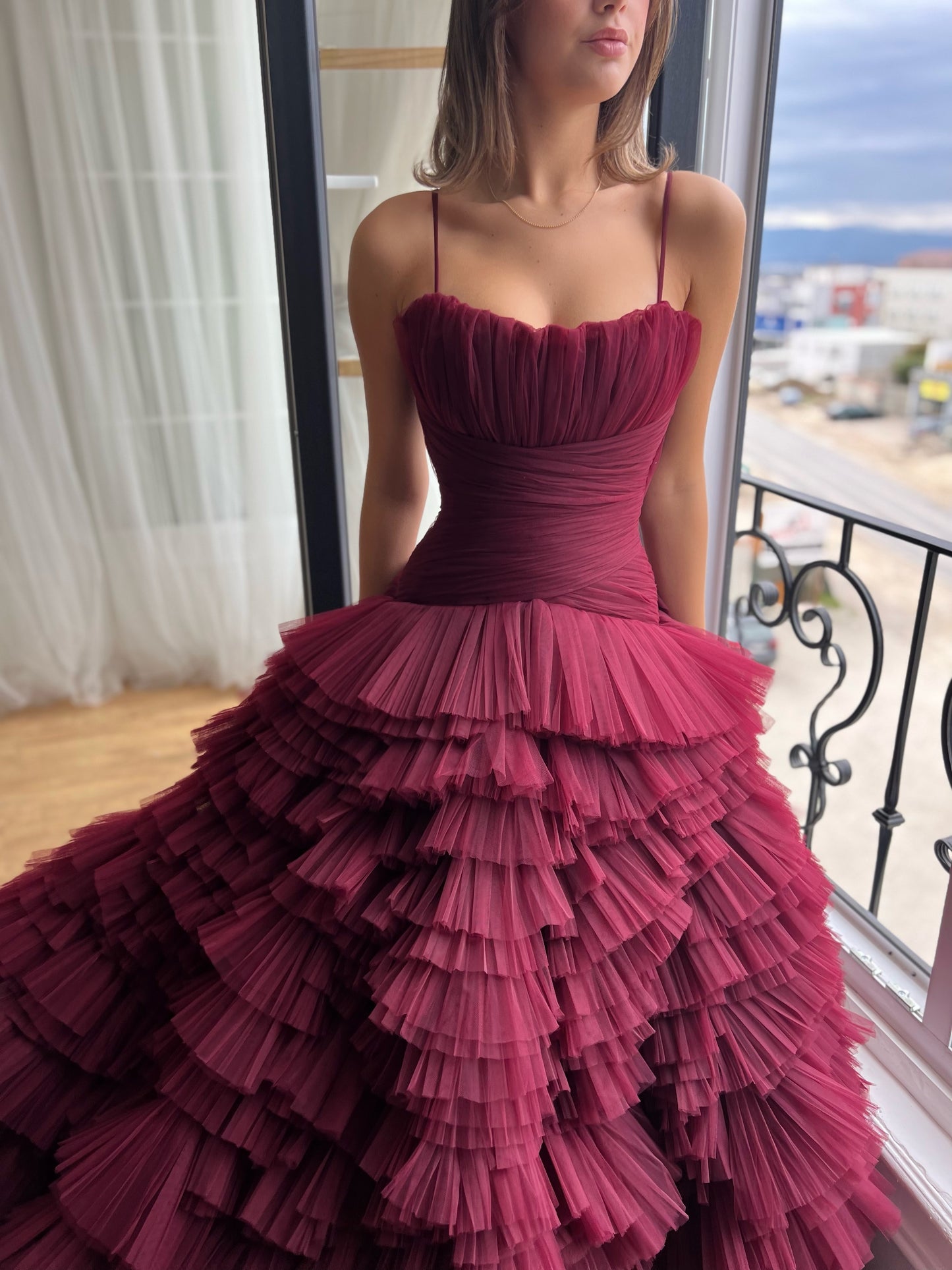 Red A-Line gown with ruffles and spaghetti straps