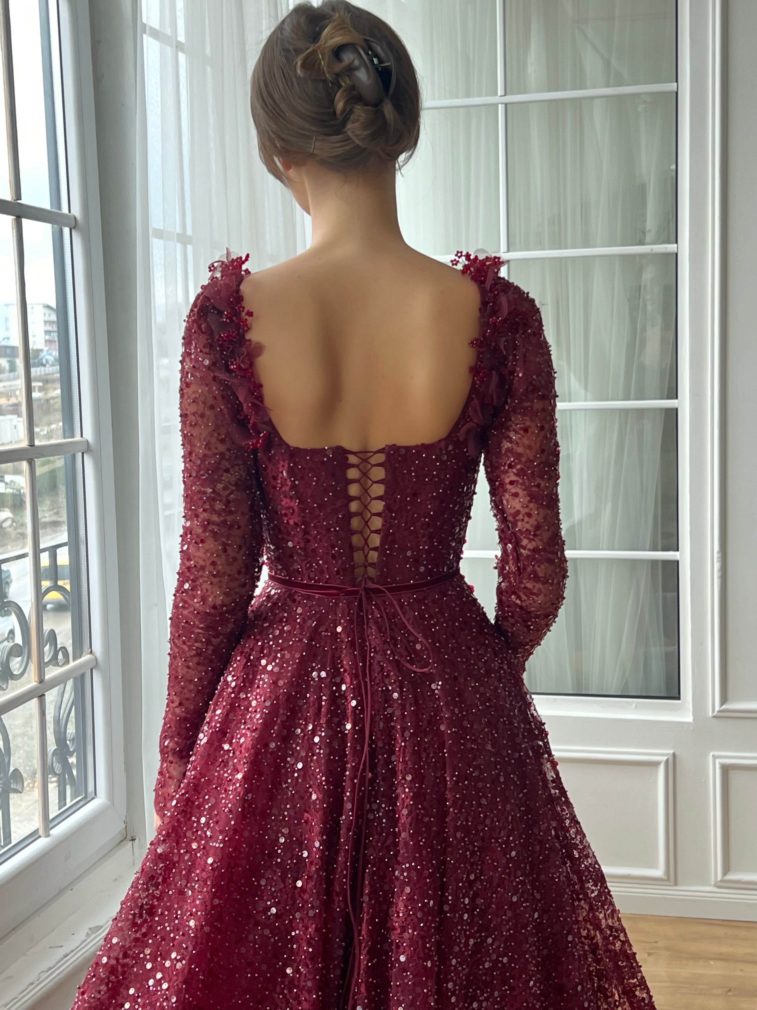 Red A-Line gown with long sleeves and embroidery