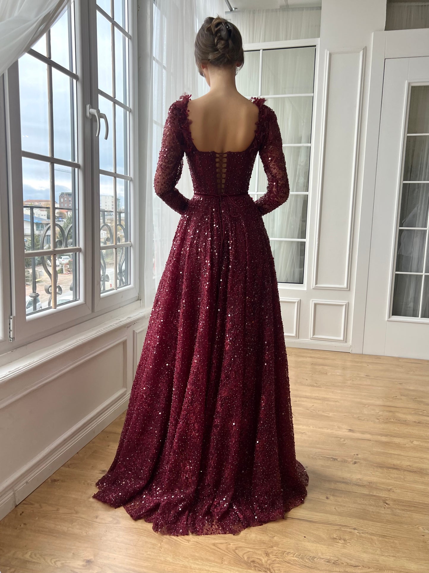 Red A-Line gown with long sleeves and embroidery