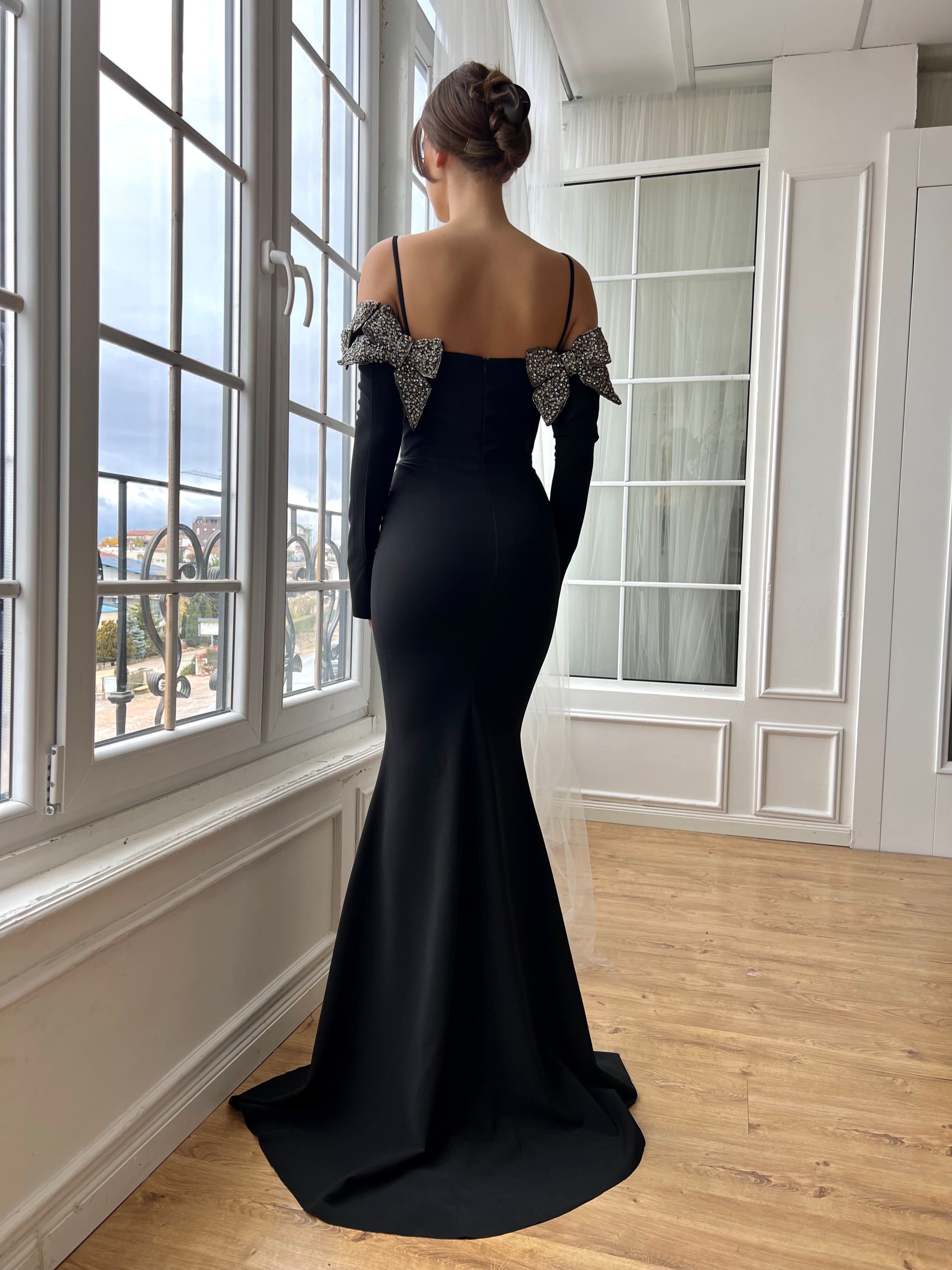 Black mermaid dress with long off the shoulder sleeves, spaghetti straps and embroidery