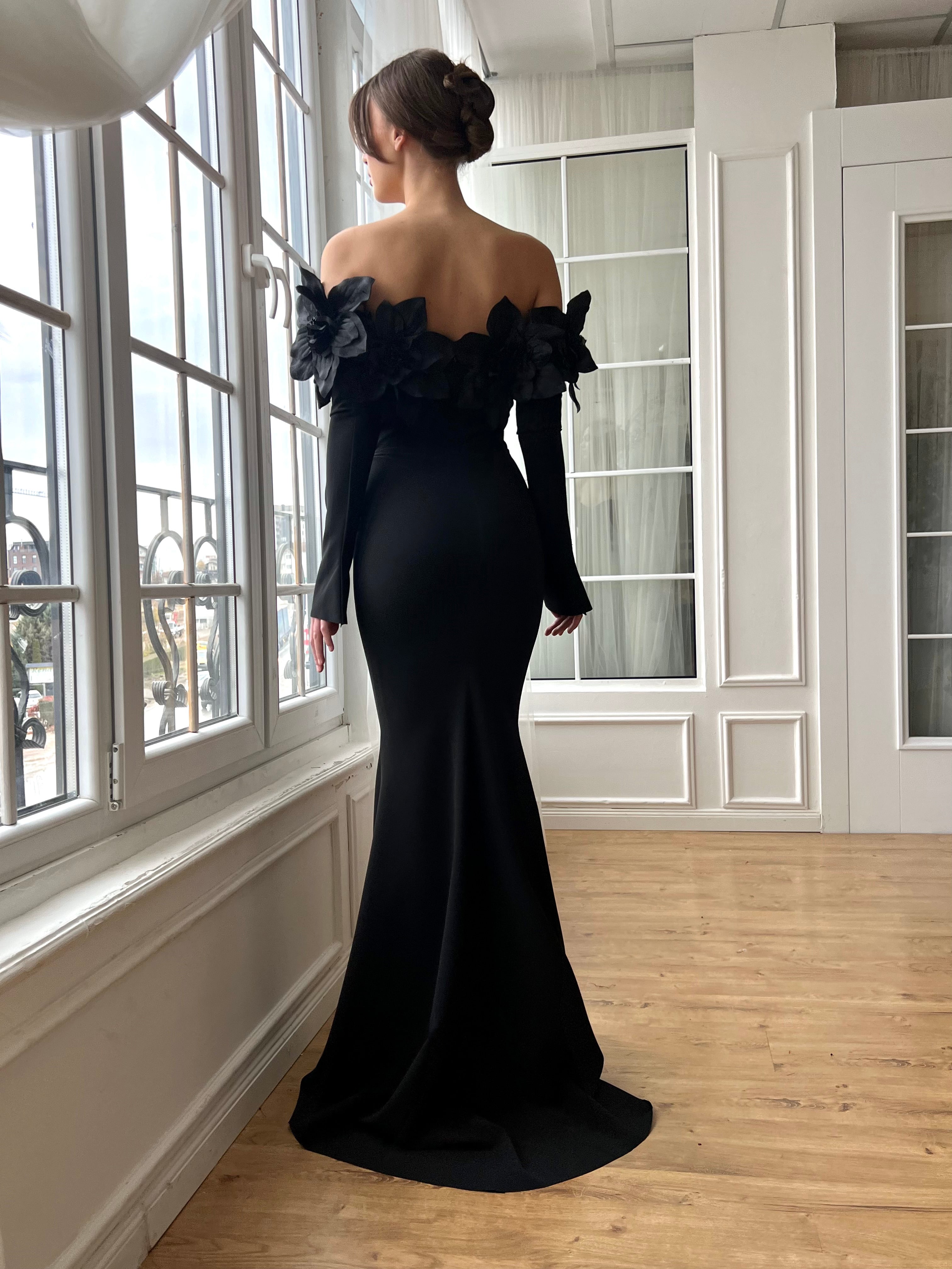 Black mermaid dress with long off the shoulder sleeves and embroidery