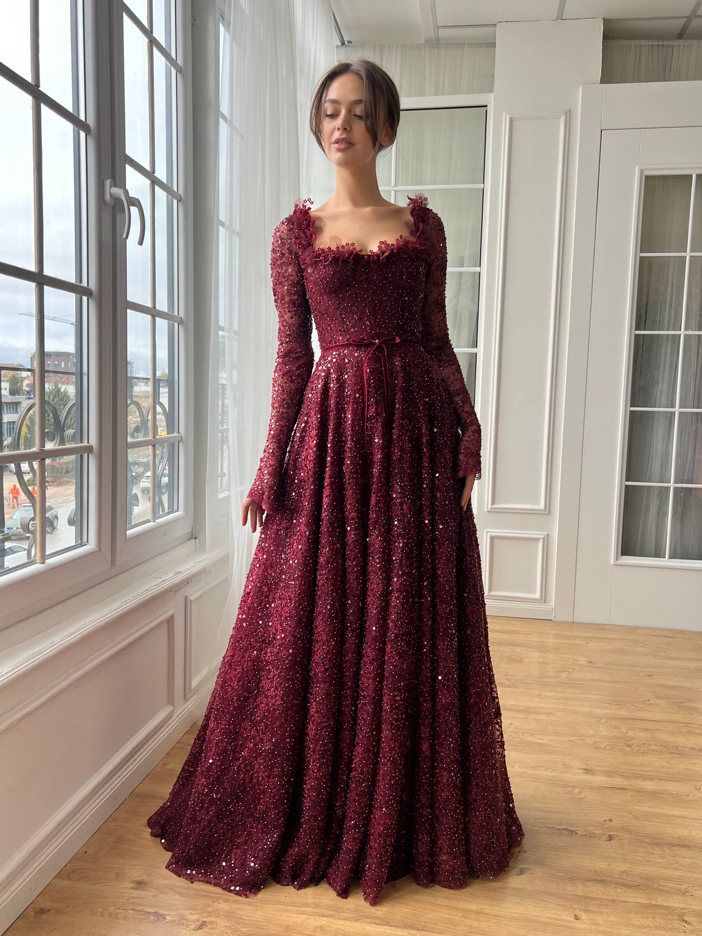 Red A-Line gown with long sleeves and embroidery