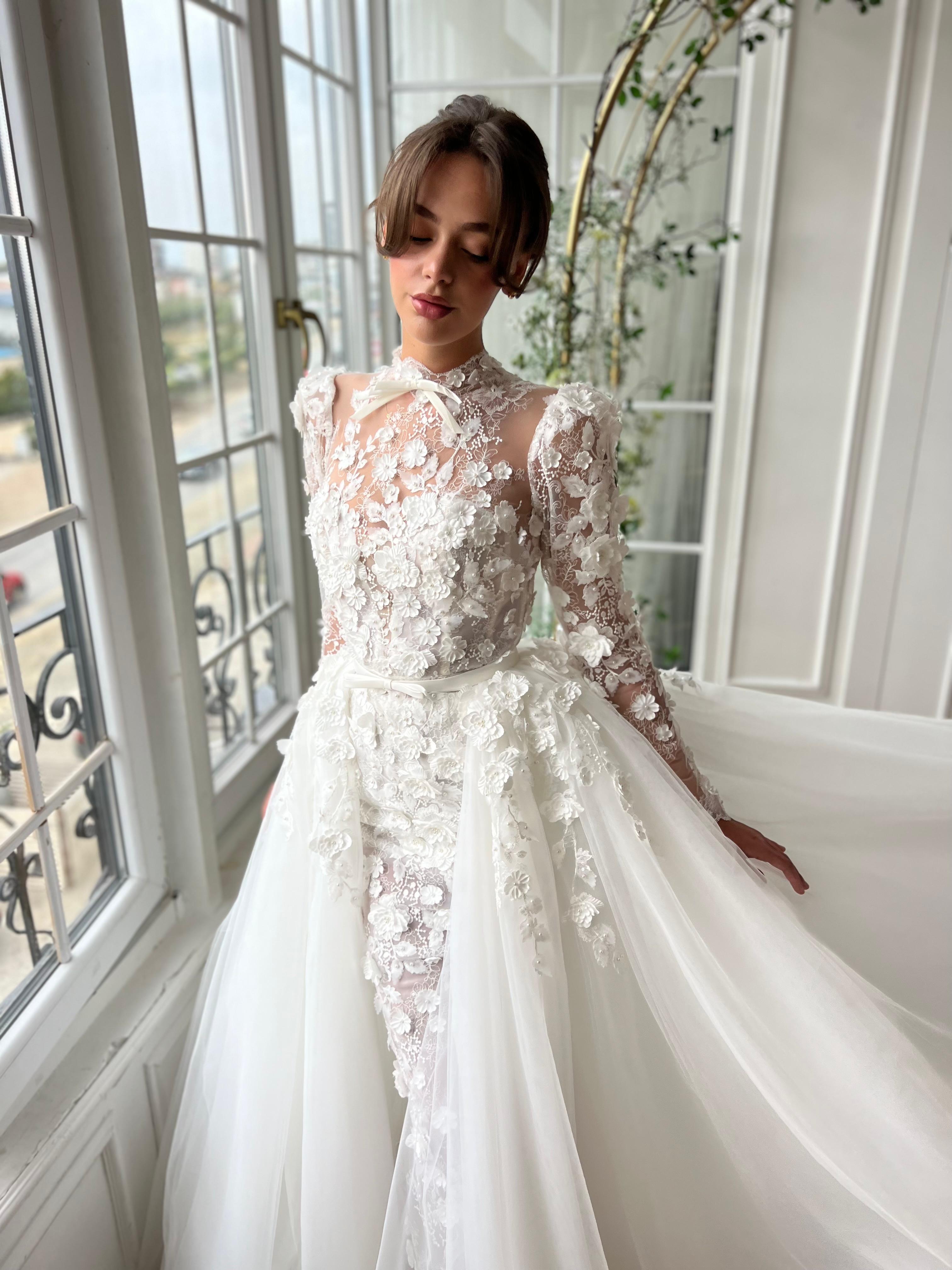 White A-Line bridal gown with long sleeves and embroidery