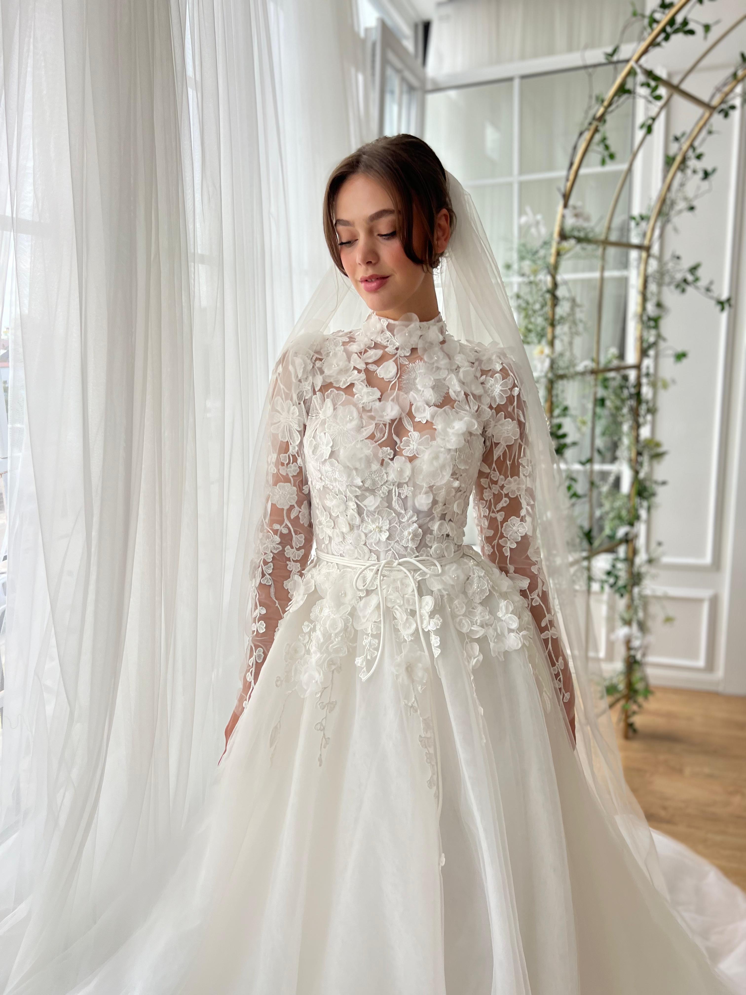 White A-Line bridal gown with long sleeves, embroidery and veil