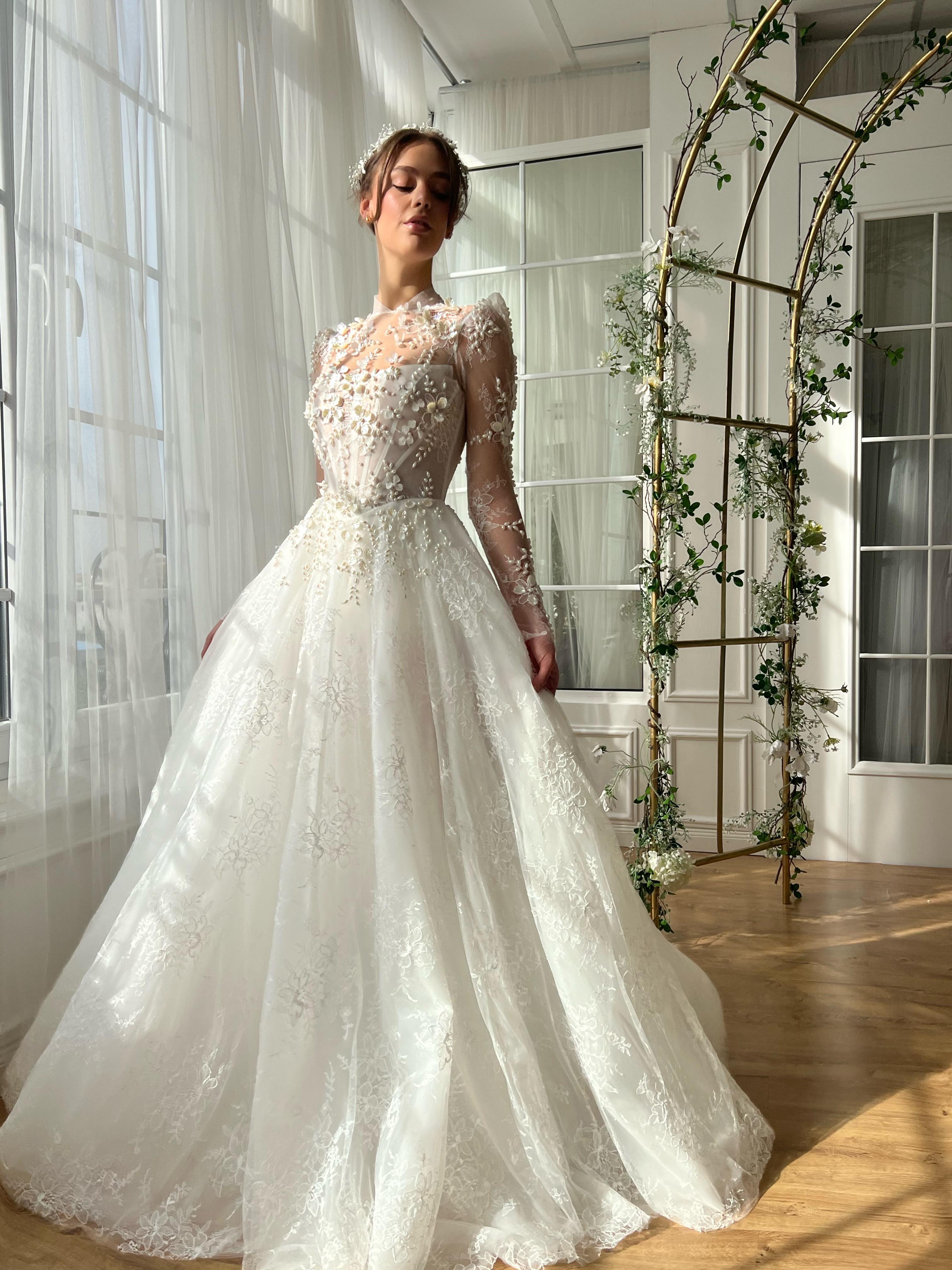 White bridal A-Line gown with beaded cape and no sleeves