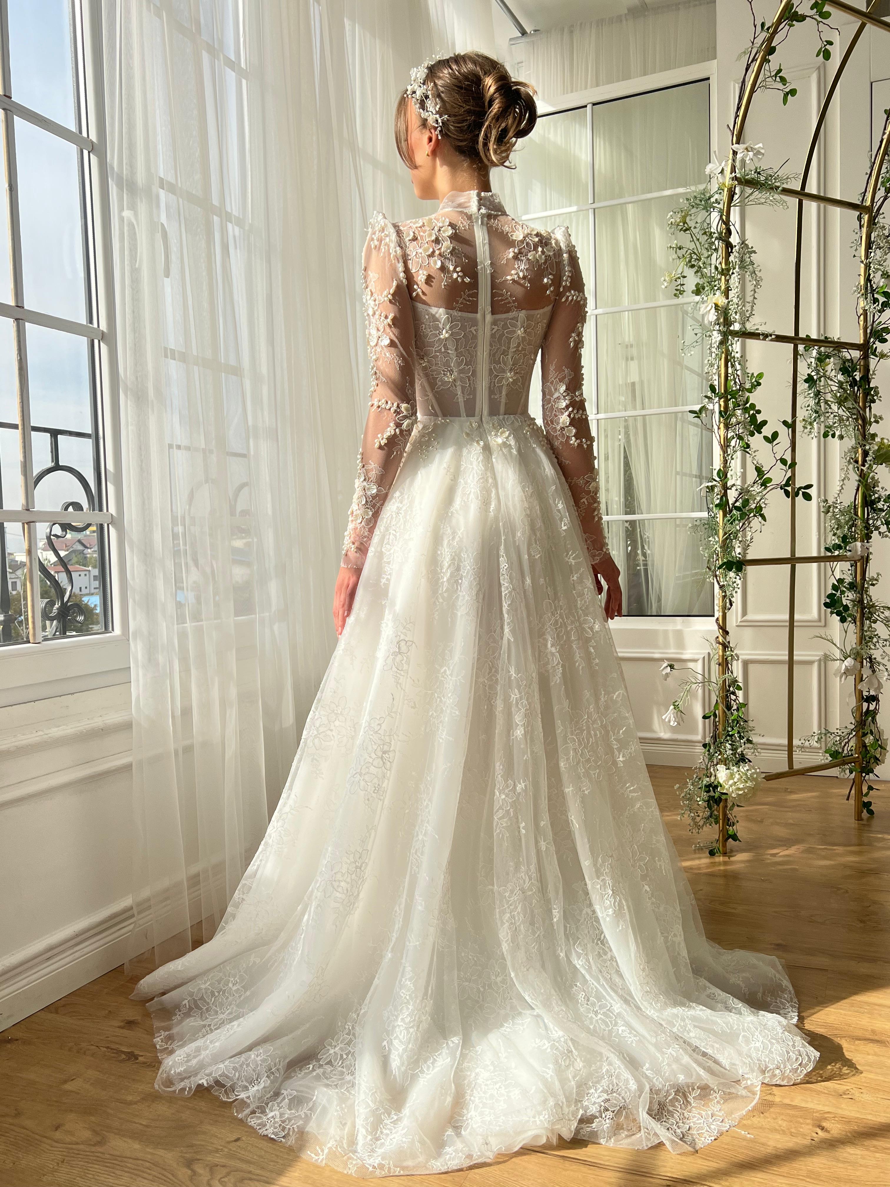 White bridal A-Line gown with beaded cape and no sleeves