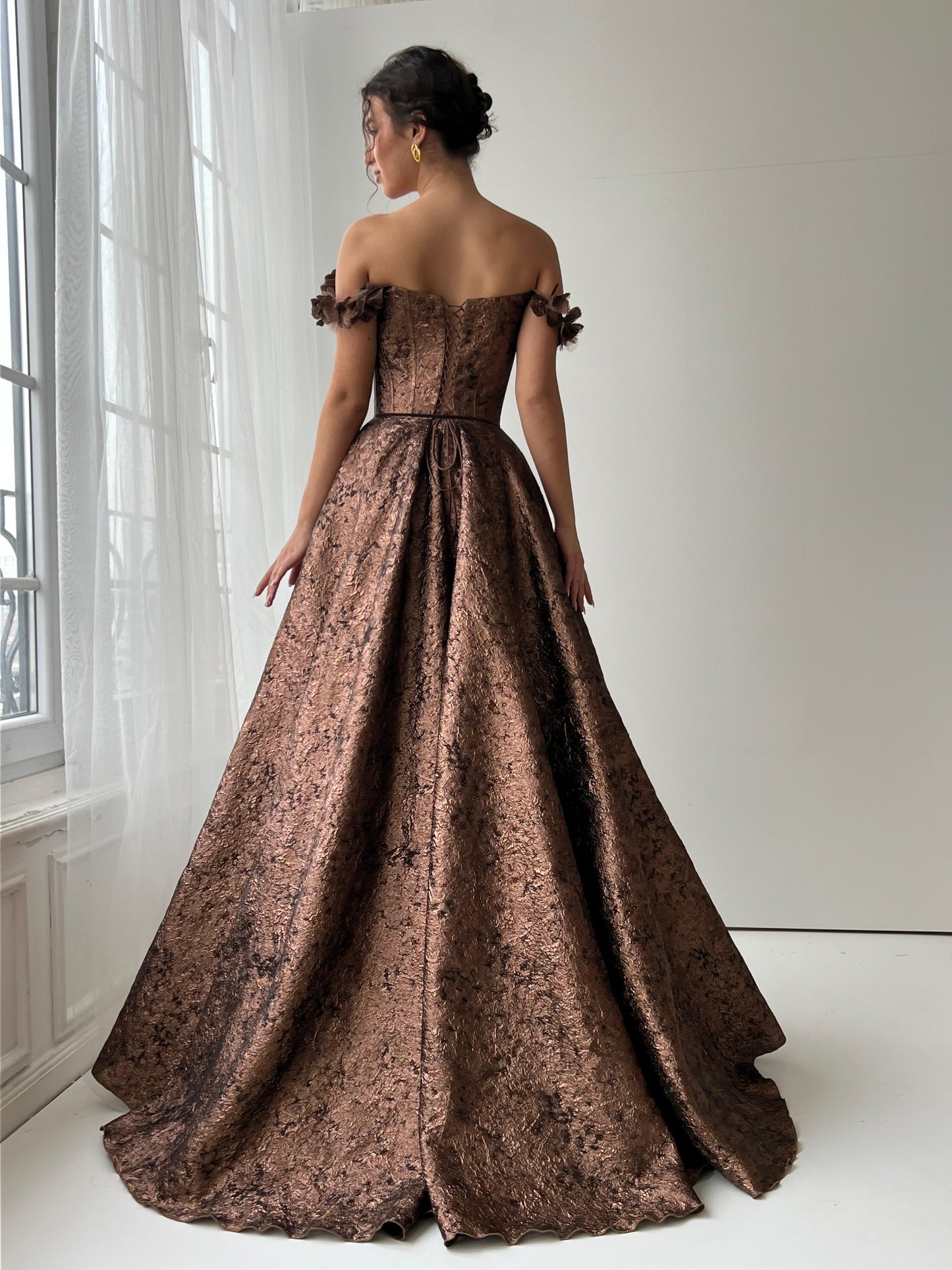 Brown A-Line dress with off the shoulder sleeves, brocade fabric and embroidery