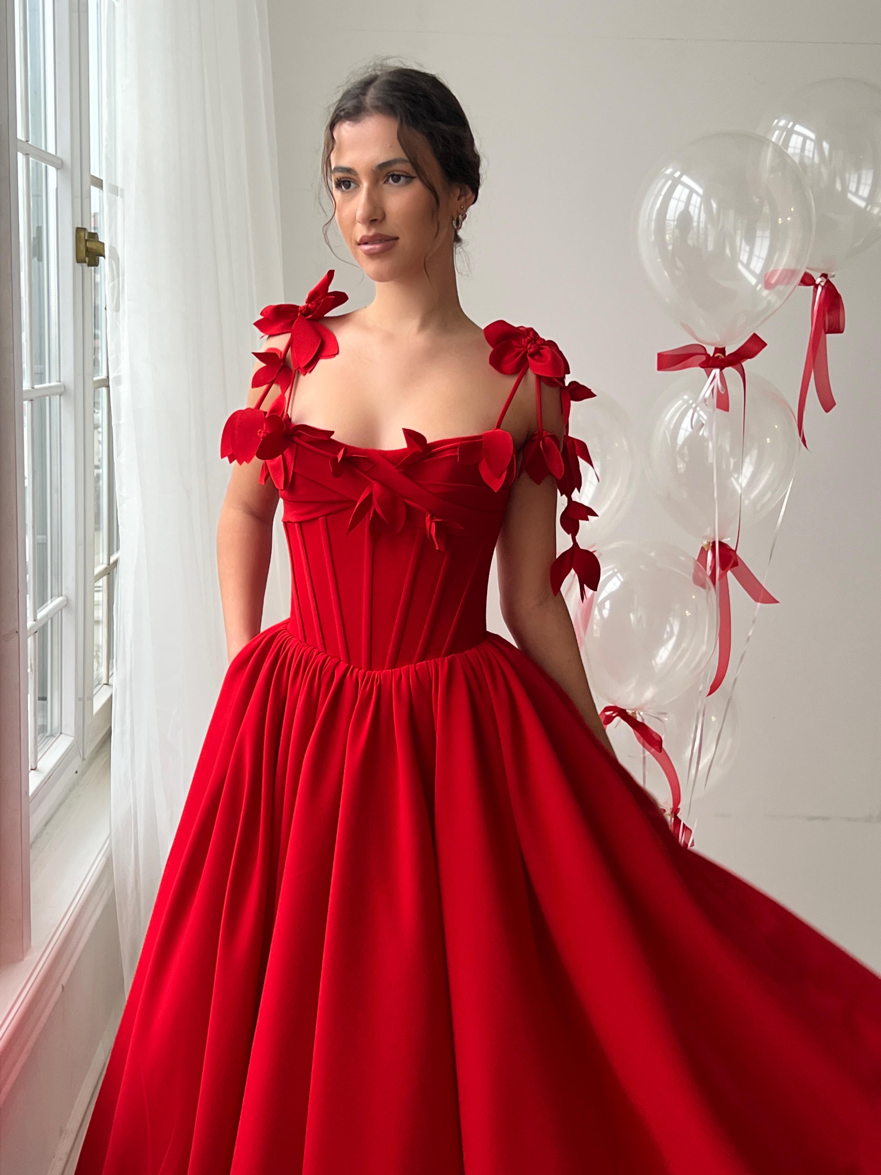 Red midi dress with spaghetti straps and embroidery