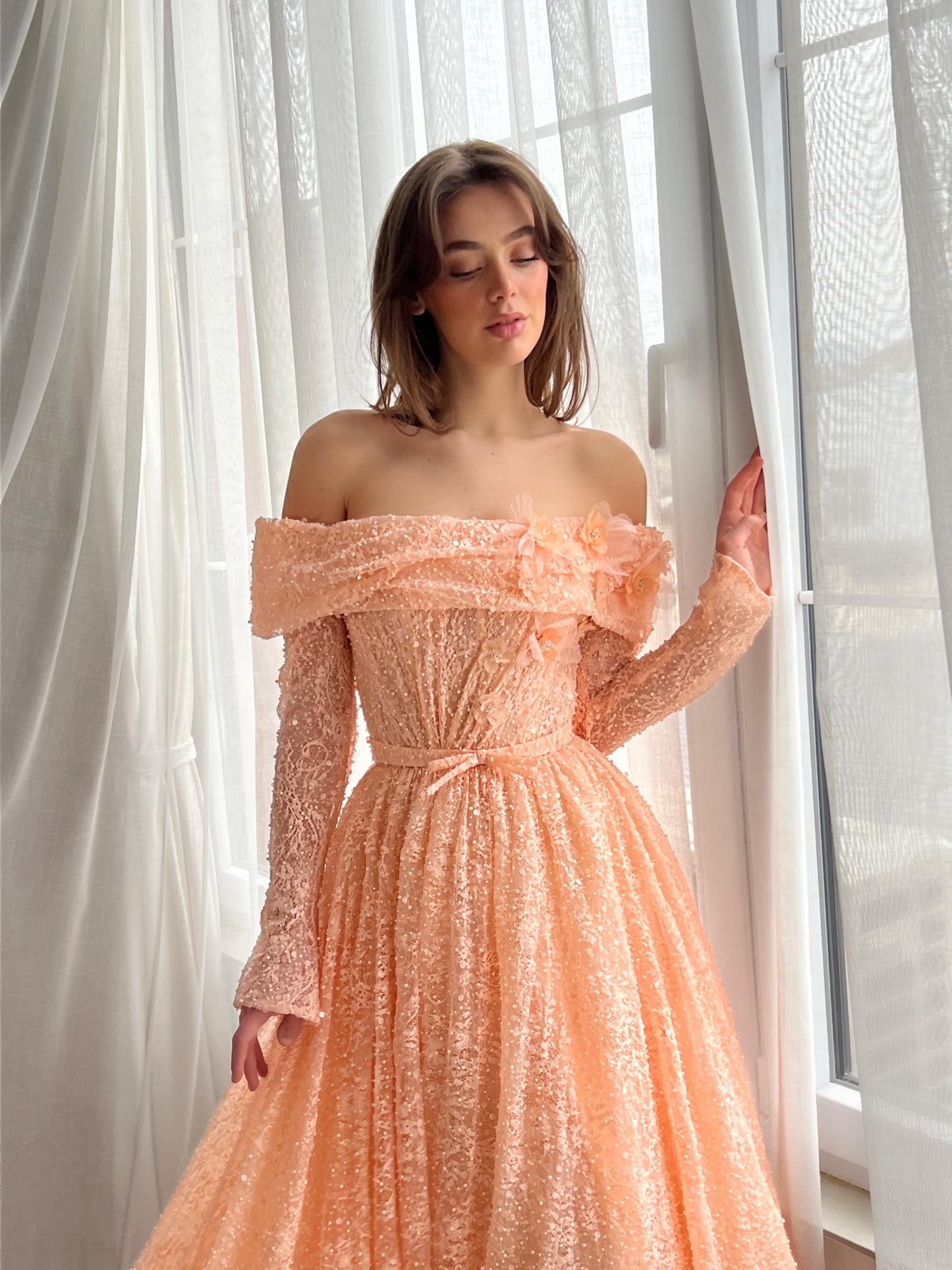 Peach A-Line dress with long off the shoulder sleeves and embroidery