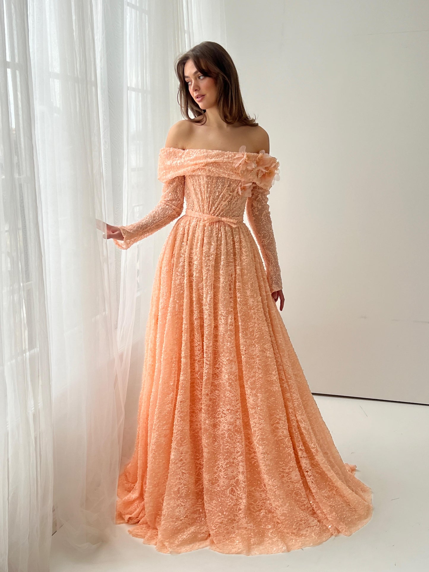 Peach A-Line dress with long off the shoulder sleeves and embroidery