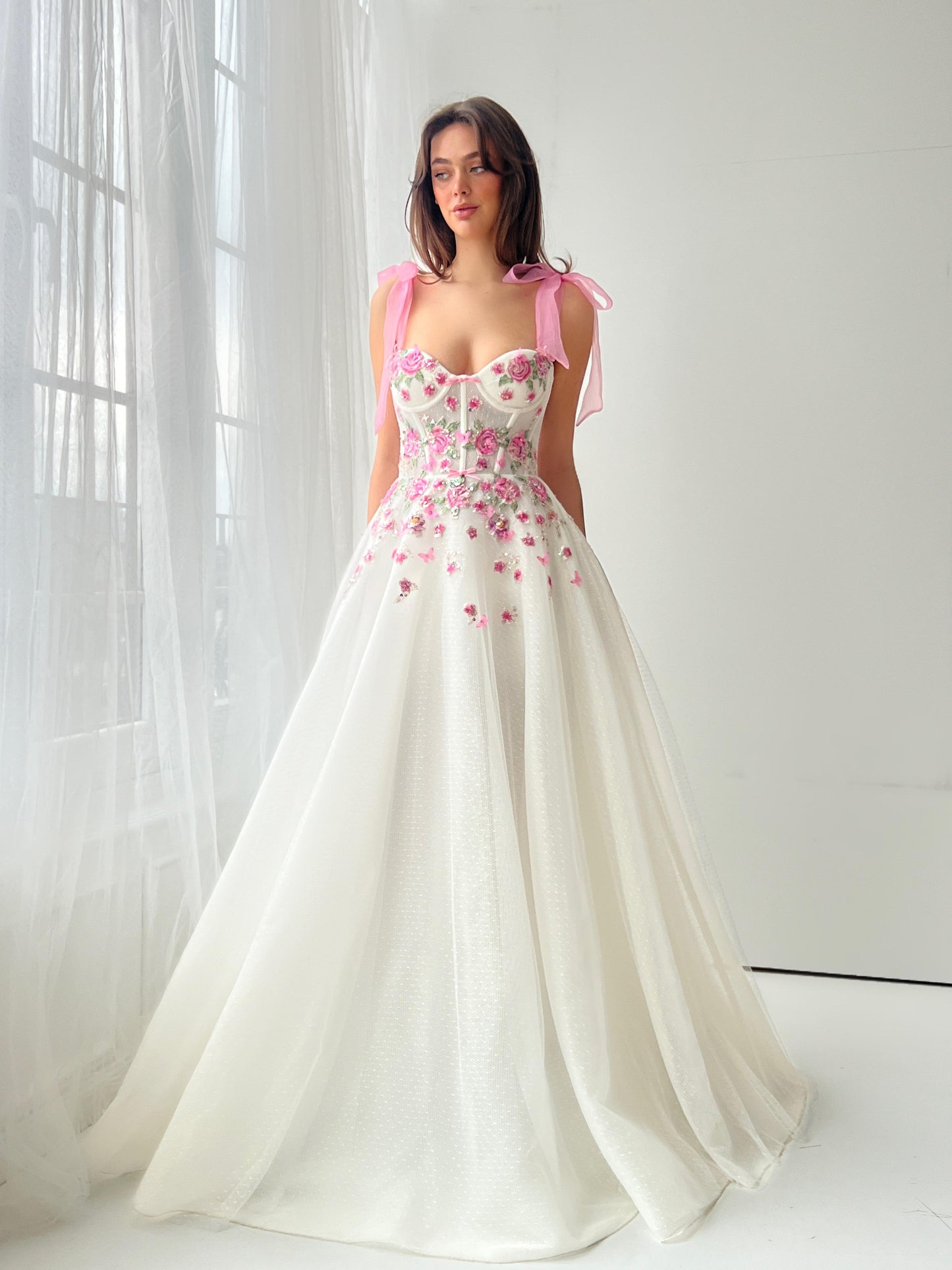 White bridal A-Line dress with pink bow straps and embroidery