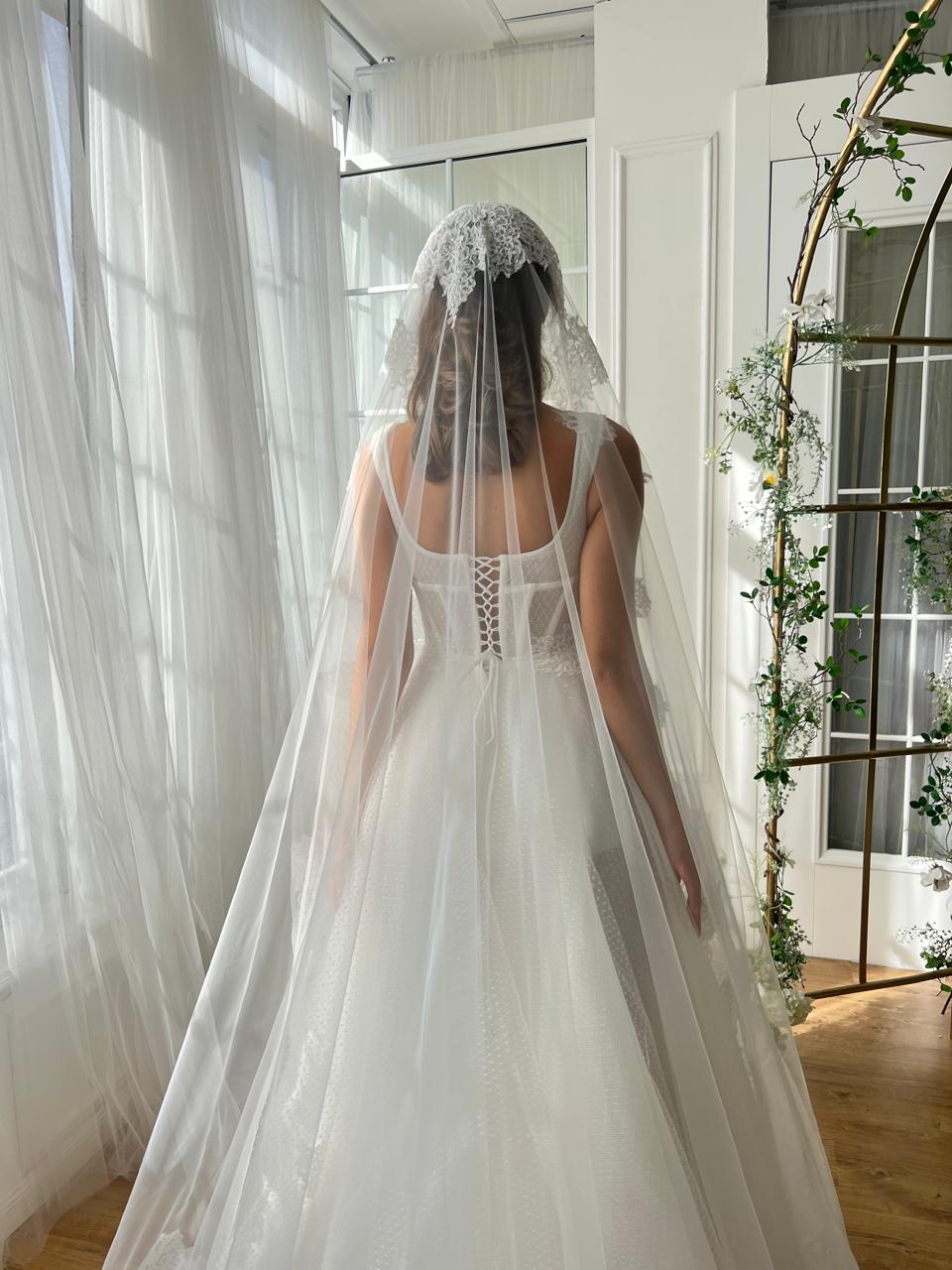 White A-Line bridal gown with straps, embroidery and veil