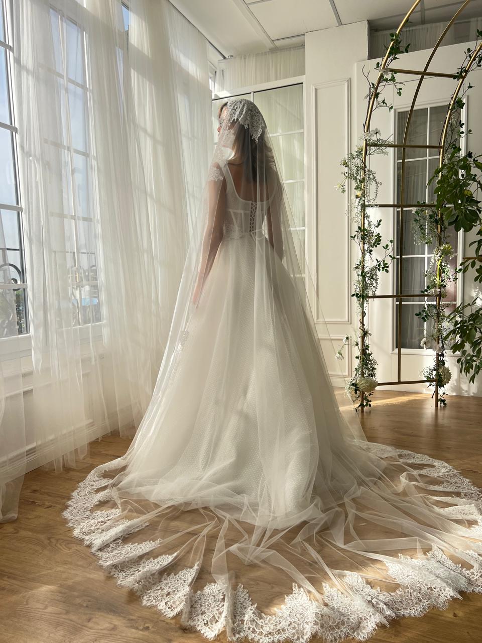 White A-Line bridal gown with straps, embroidery and veil