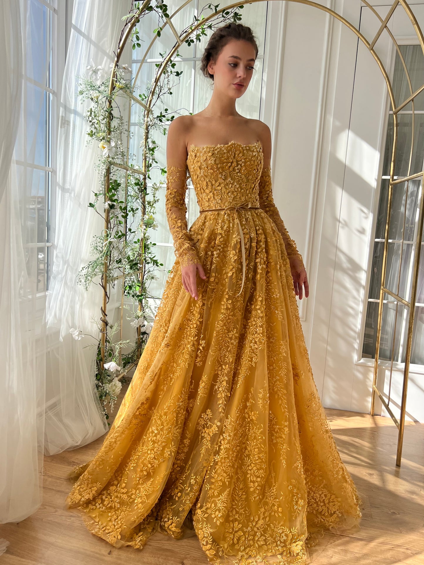 Gold A-Line dress with long off the shoulder sleeves and embroidery