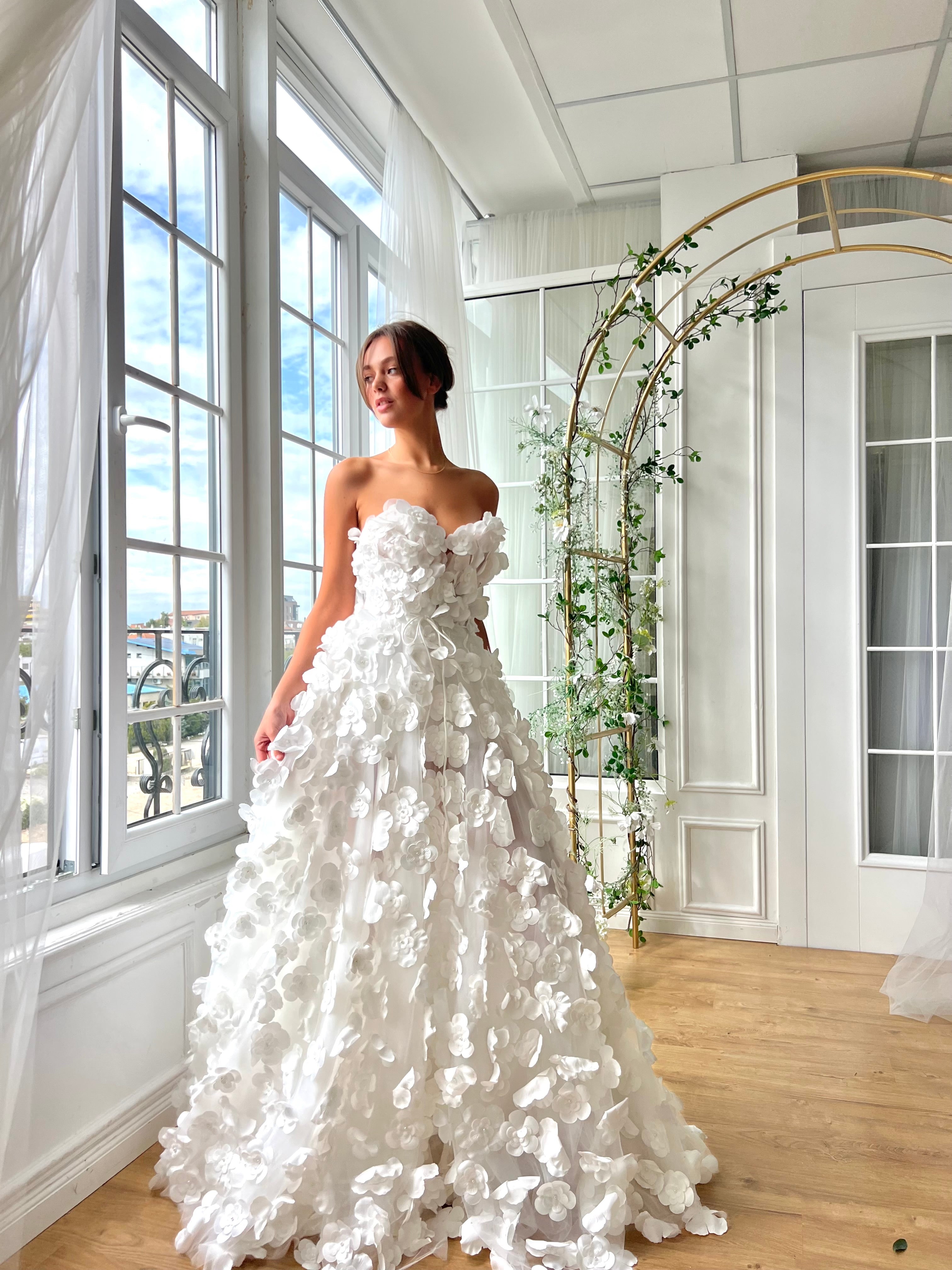 White bridal A-Line gown with embroidery and no sleeves