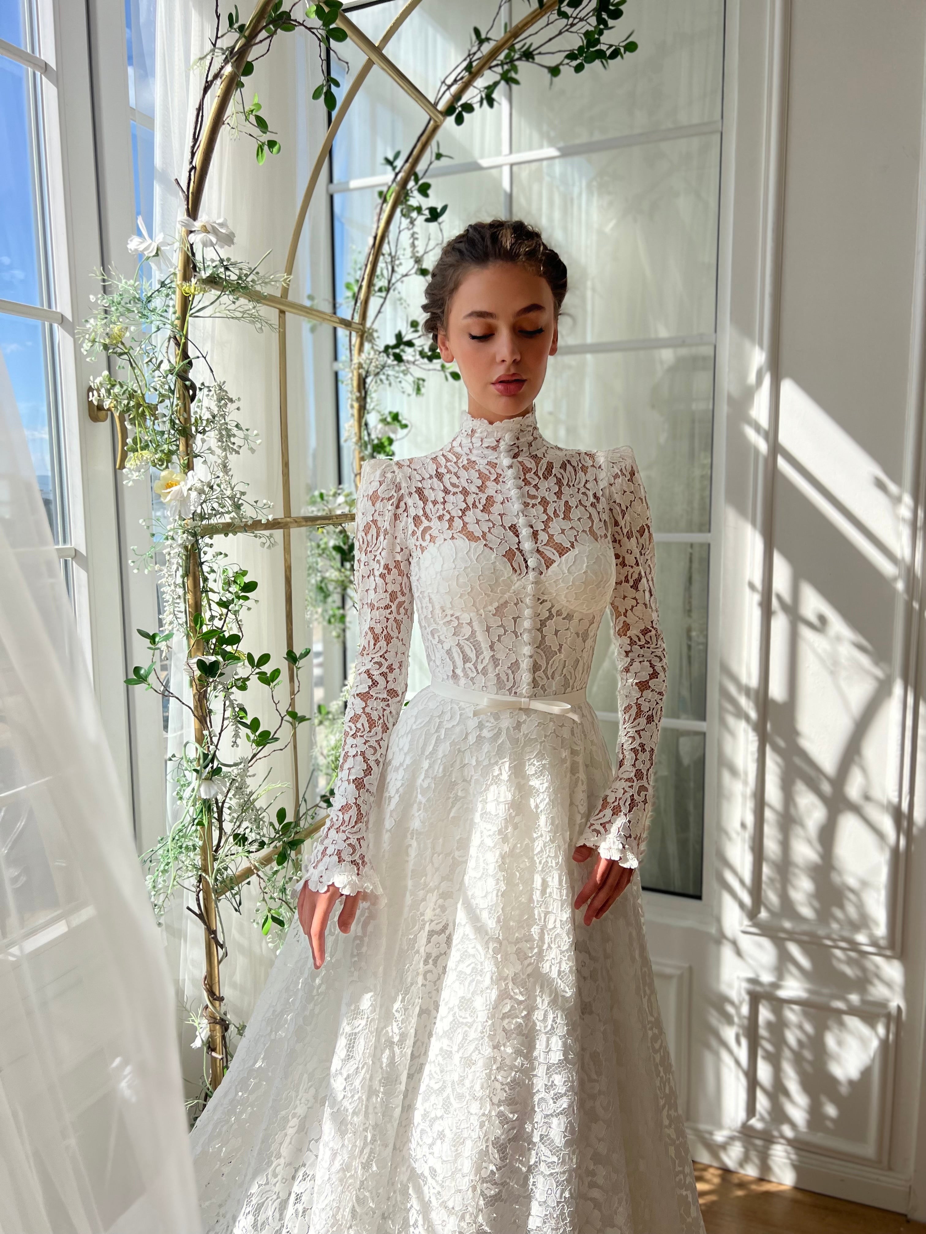 White bridal A-Line gown with long sleeves and embroidery