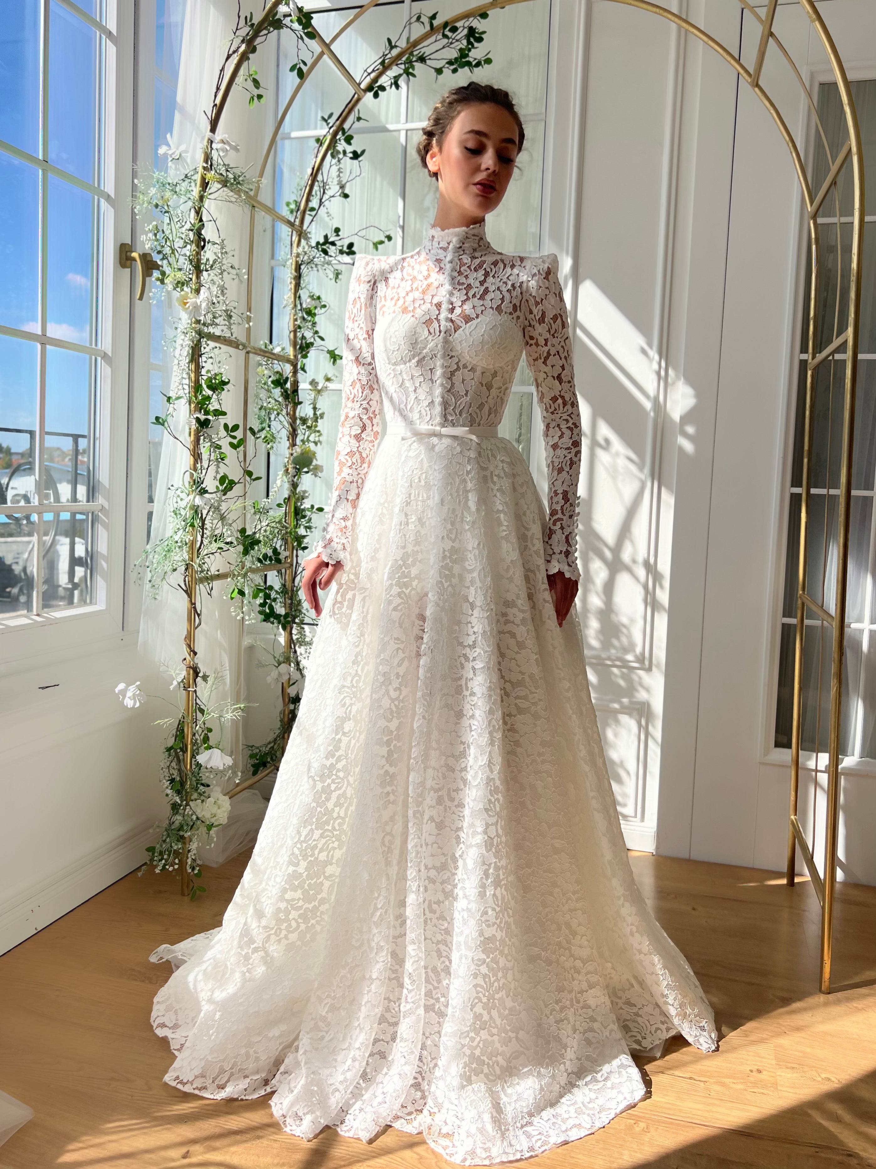 White bridal A-Line gown with long sleeves and embroidery