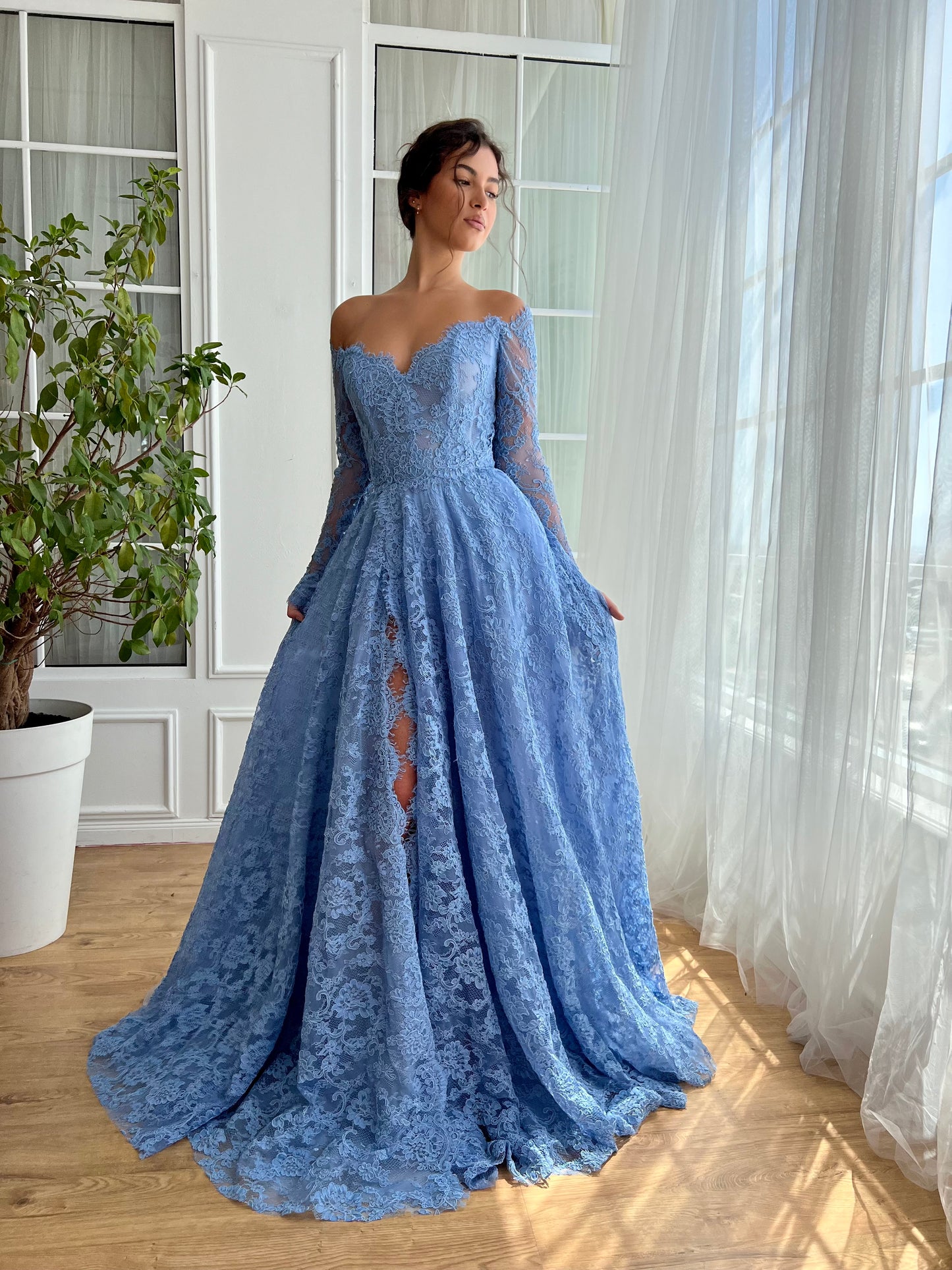 Blue A-Line gown with long off the shoulder sleeves and lace