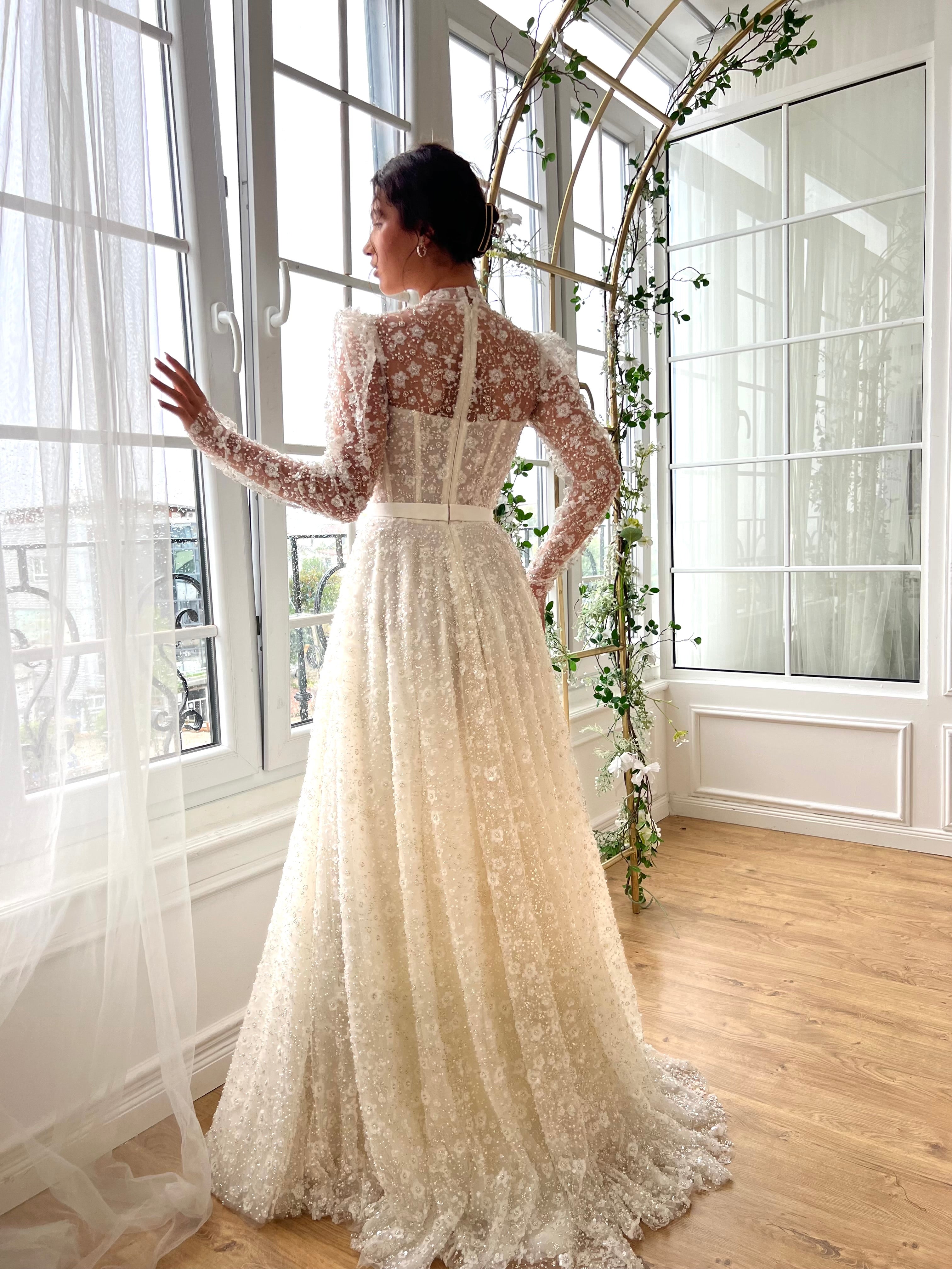 white bridal A-Line gown with long sleeves and embroidery