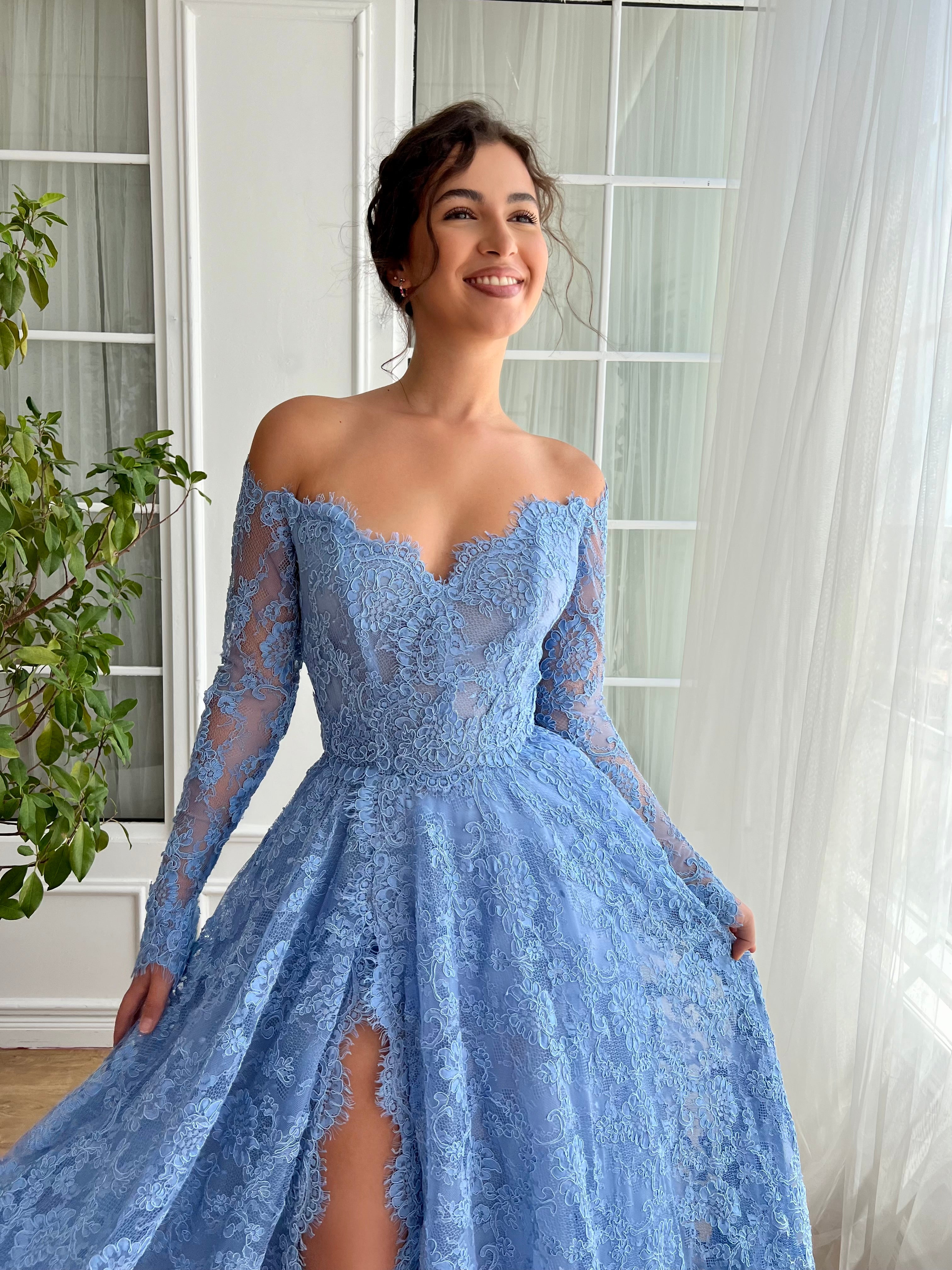 Blue A-Line gown with long off the shoulder sleeves and lace