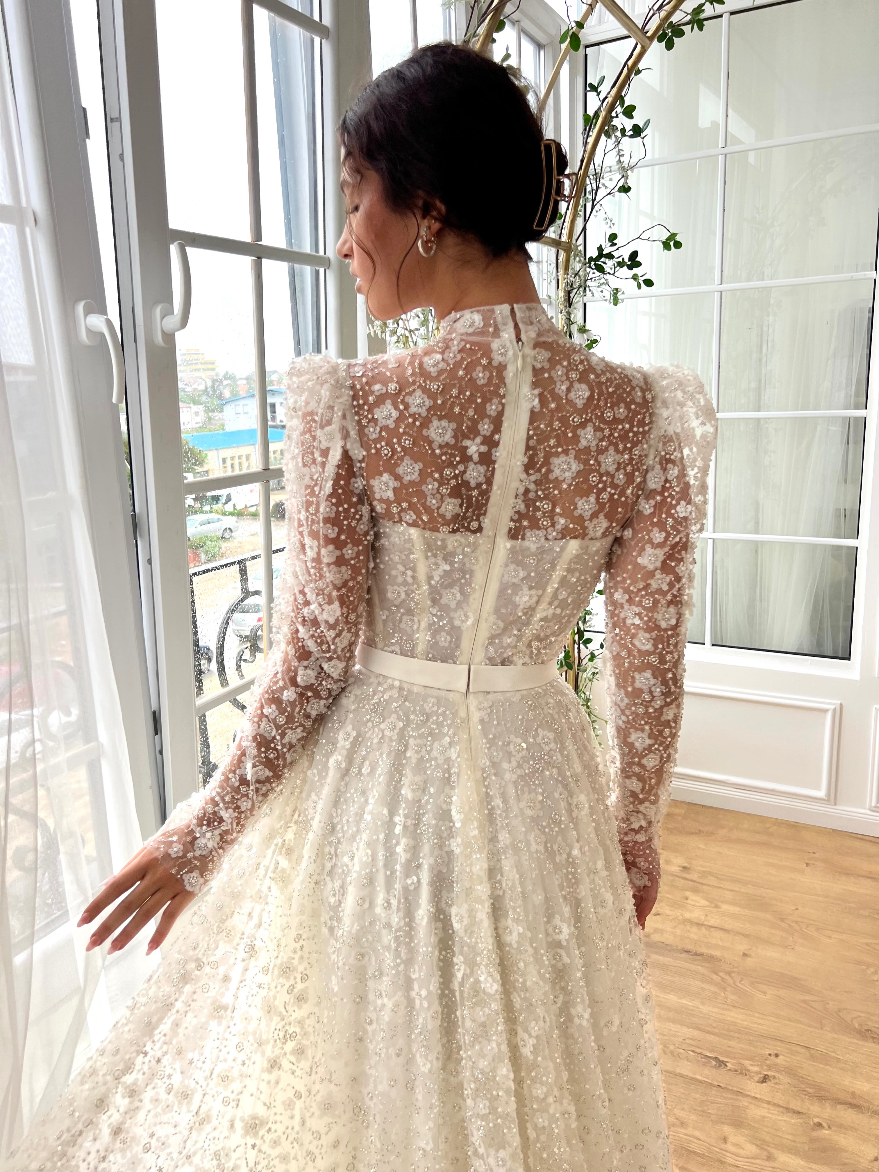 white bridal A-Line gown with long sleeves and embroidery