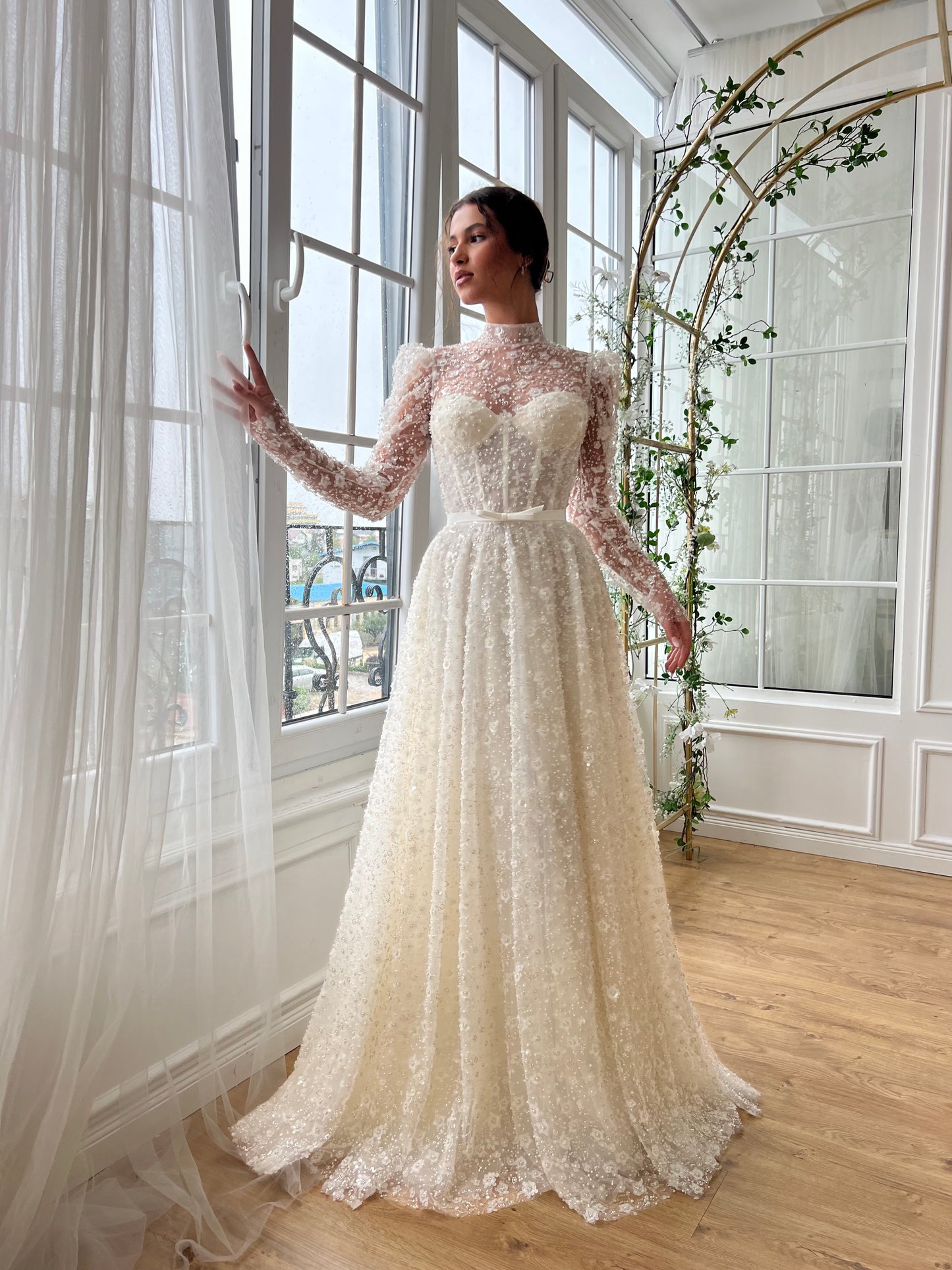 white bridal A-Line gown with long sleeves and embroidery